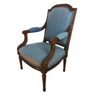Blue upholstered Louis XVI fauteuil, side angle.