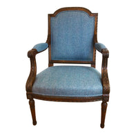 Front view, Louis XVI blue upholstered fauteuil.