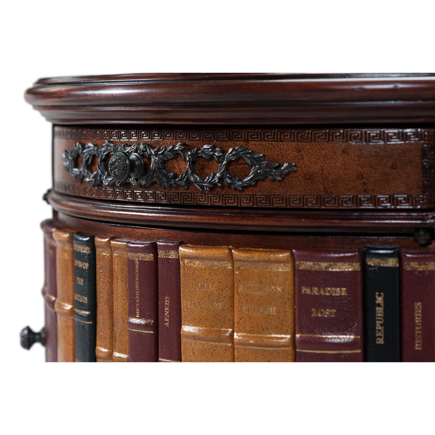 Close-up of Louis XVI table with decorative book spines.