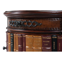 Close-up of Louis XVI table with decorative book spines.