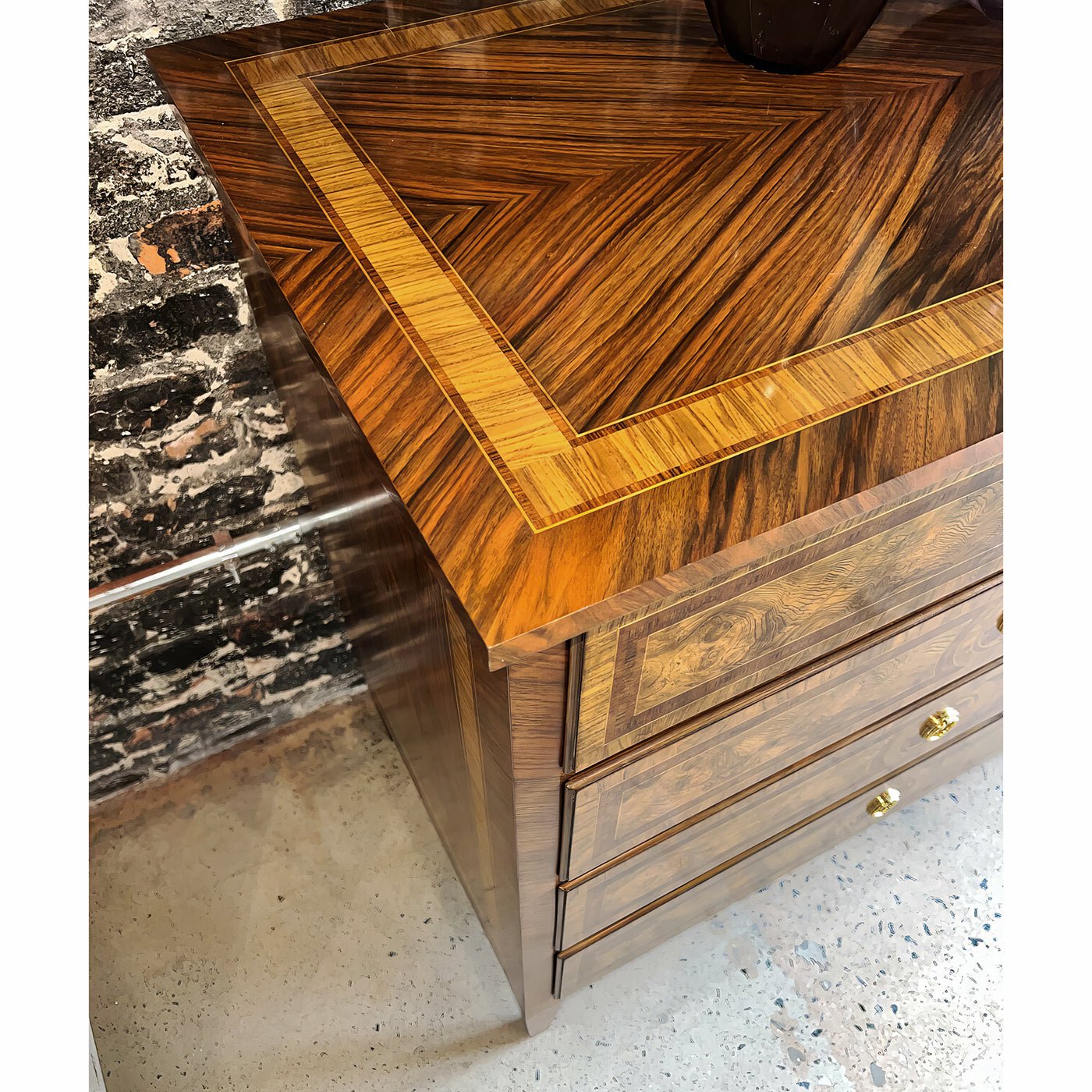 Close-up of dresser's wood grain and top detail.