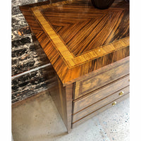 Close-up of dresser's wood grain and top detail.