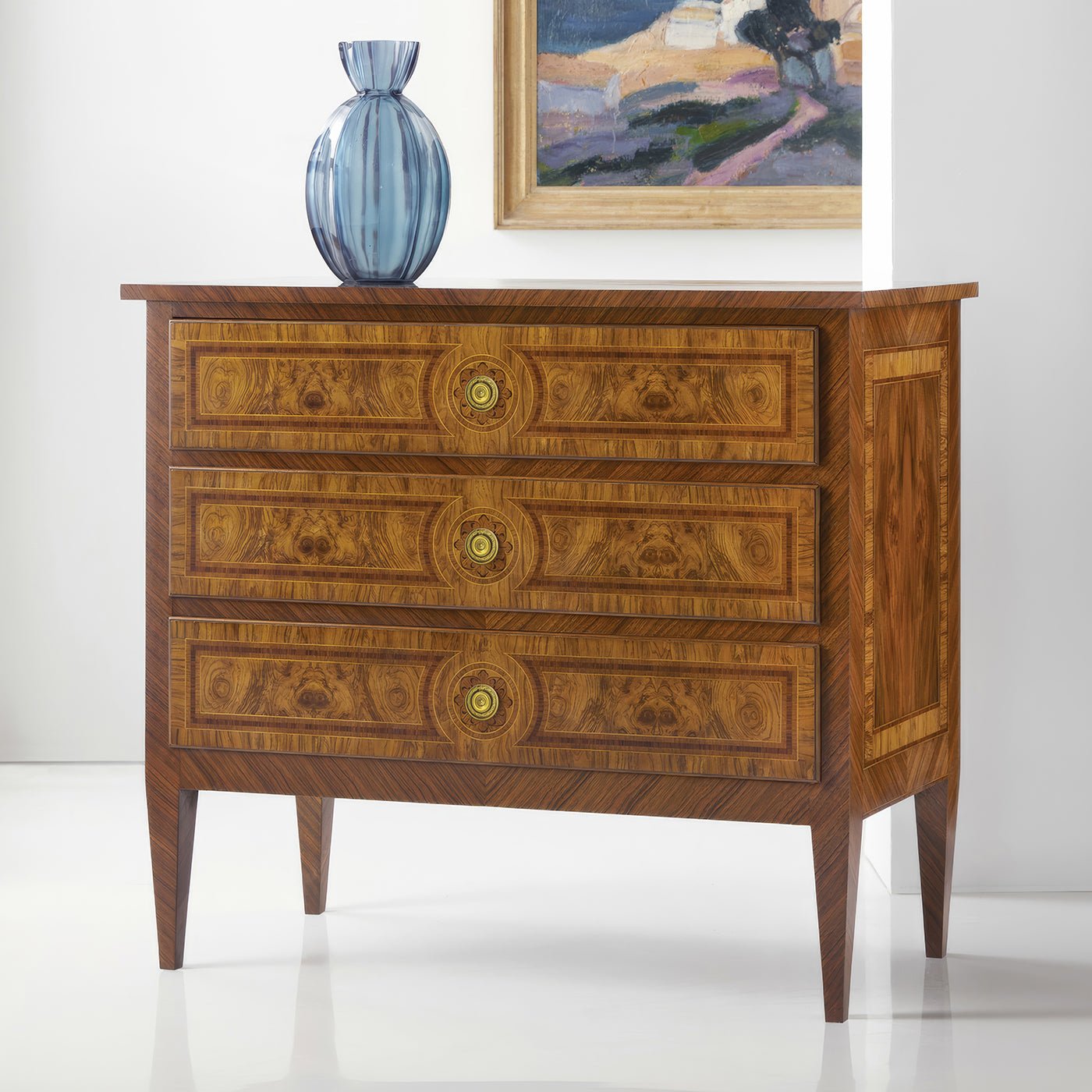 Louis XVI nightstand with vase and painting, interior setting.