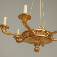 Close-up of intricate detailing on chandelier base.