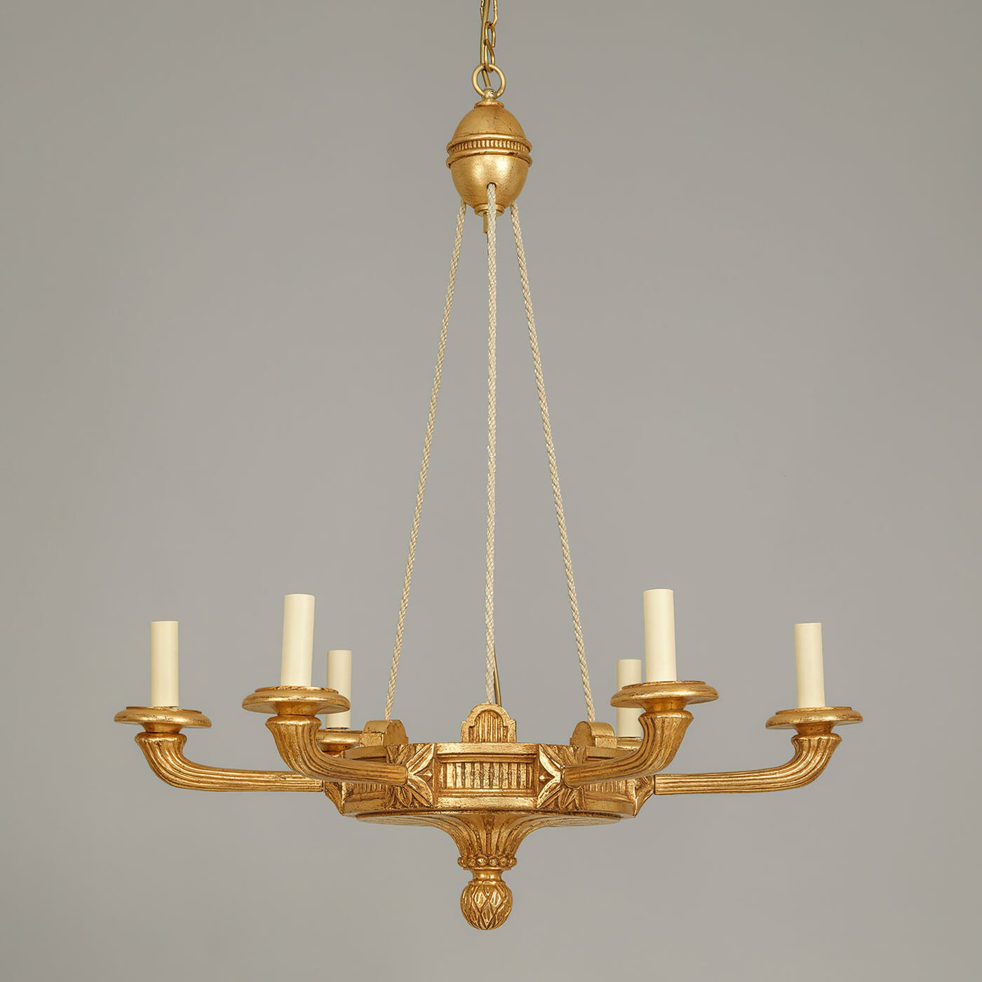 Detailed view of elegant Louis XVI chandelier design.
