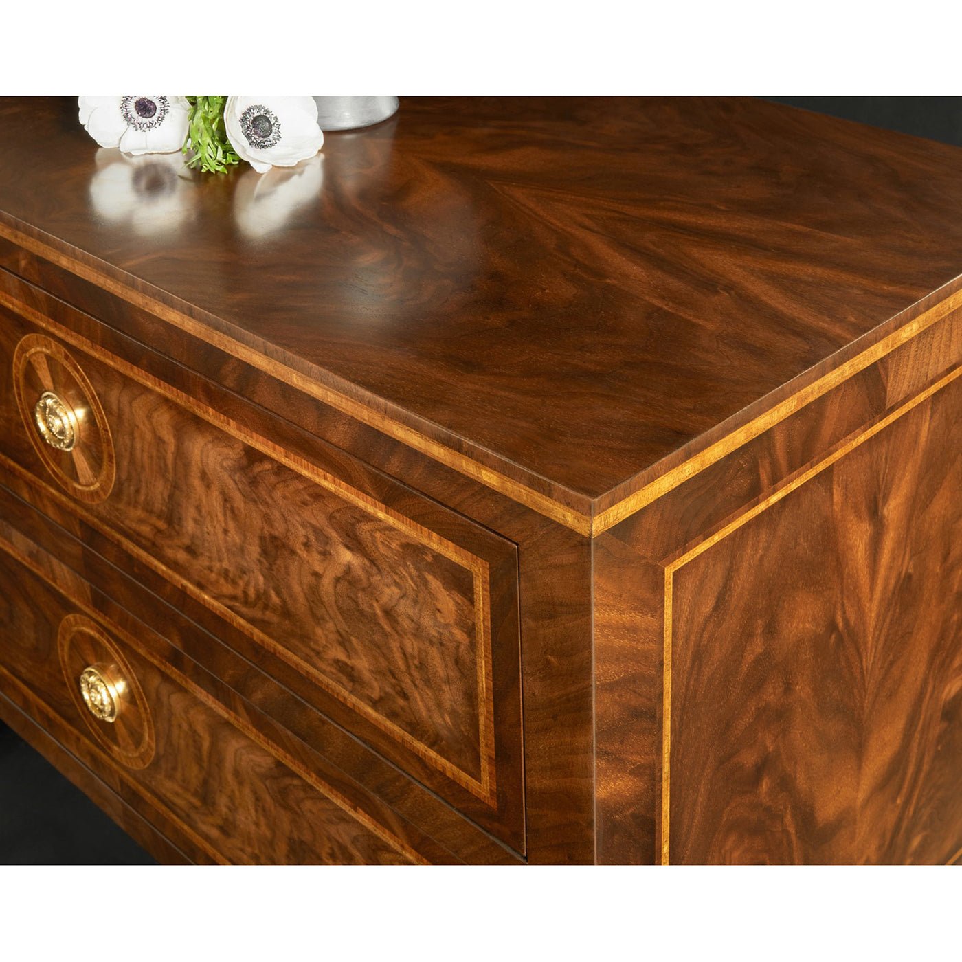 Angled view of wooden bedside chest top surface.