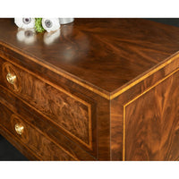 Angled view of wooden bedside chest top surface.