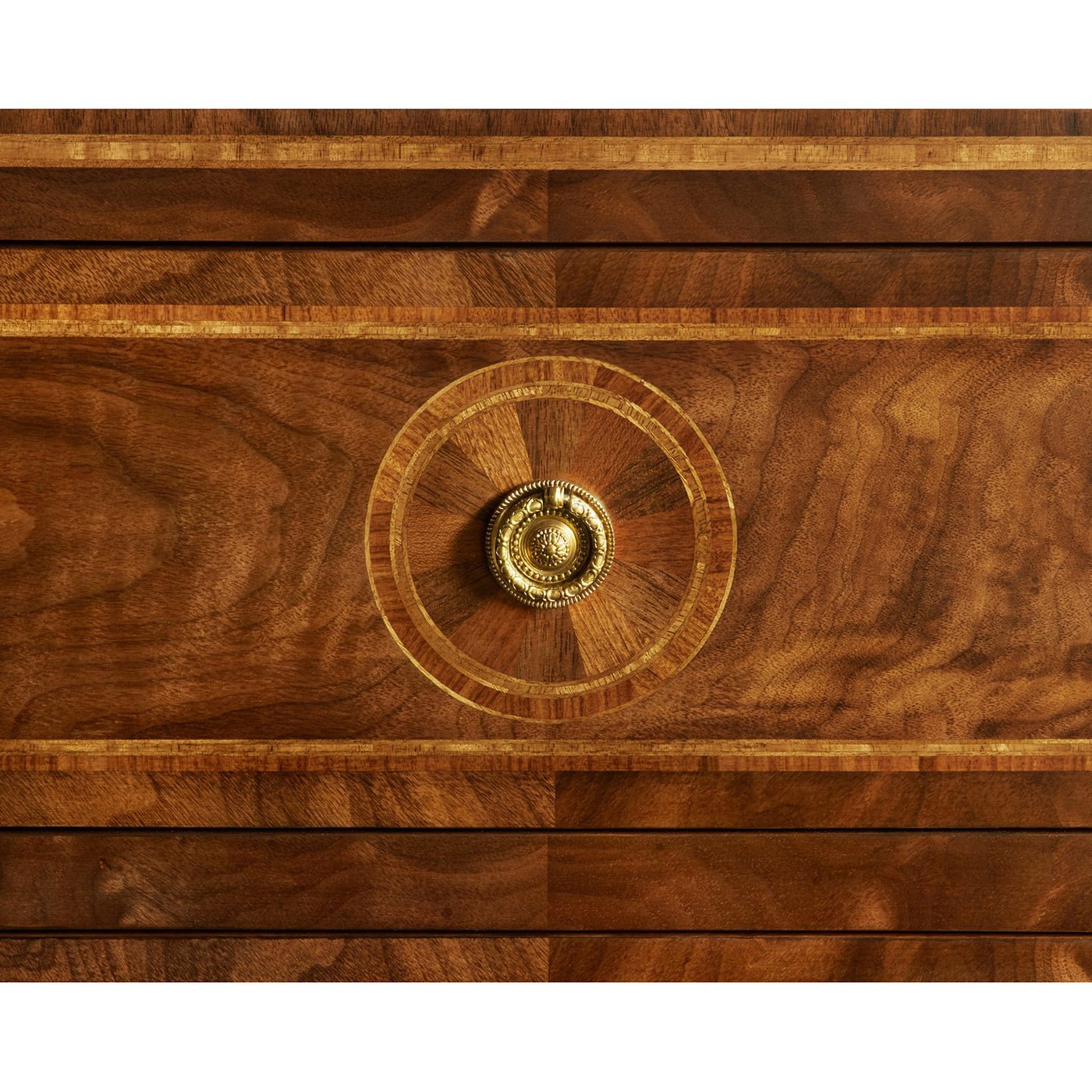 Close-up of intricate inlay and drawer knob detail.