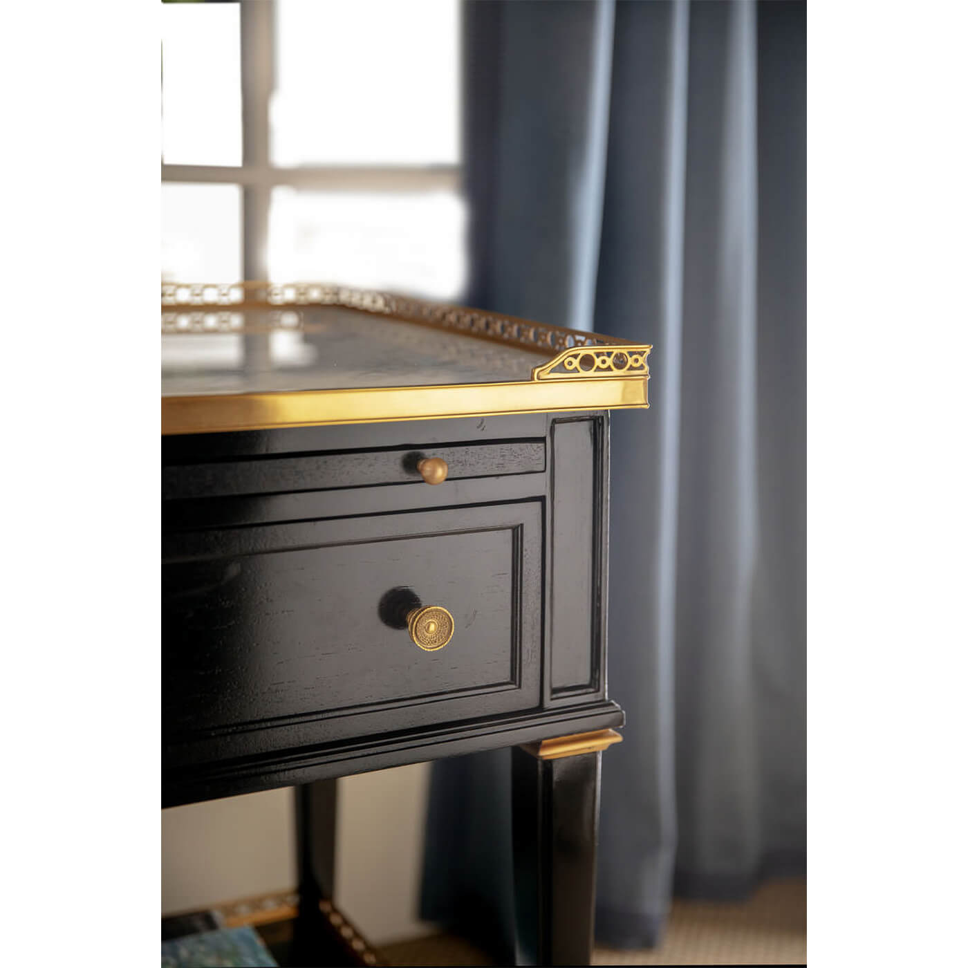 Close-up of nightstand's gold trim detail.