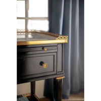 Close-up of nightstand's gold trim detail.