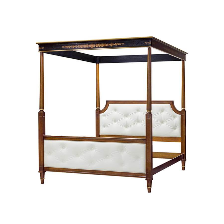 Elegant canopy bed with tufted white upholstery detail.