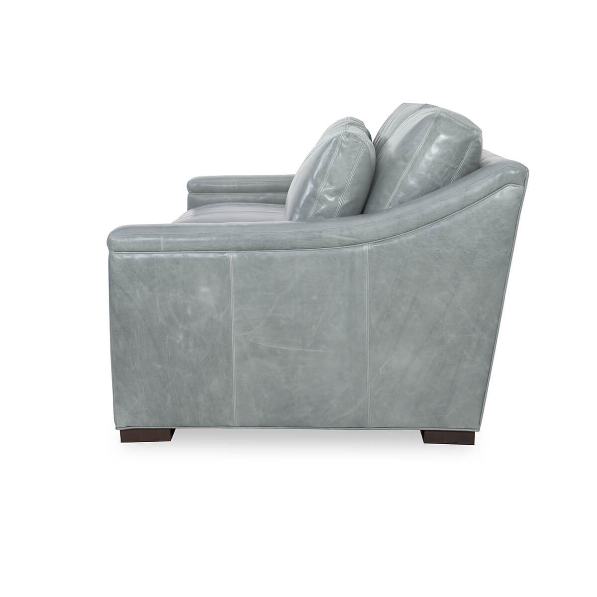 Gray leather sofa, side view, armrest details.