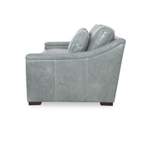 Gray leather sofa, side view, armrest details.