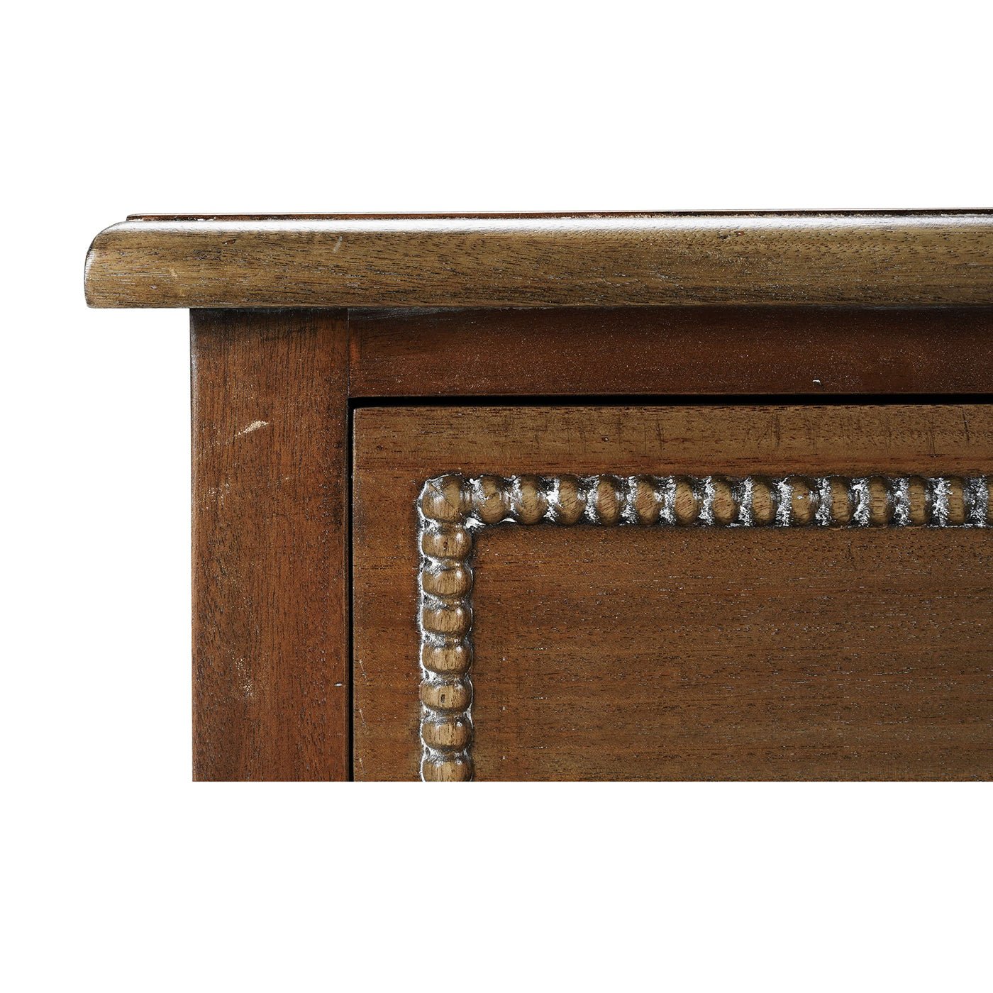 Close-up of mahogany chest corner detailing.