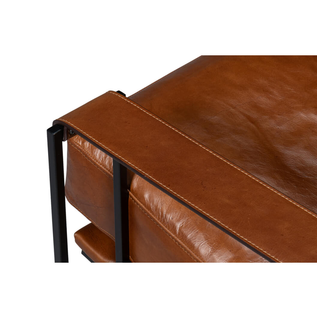 Top view detail of leather armrest on chair.