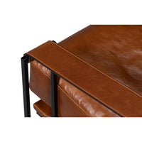 Top view detail of leather armrest on chair.