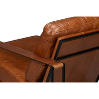 Angled back view showing leather cushion and armrest.