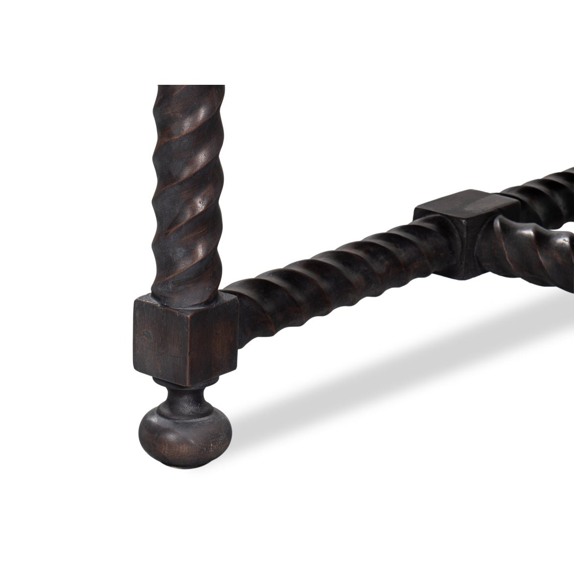 Close-up of table leg base detail.