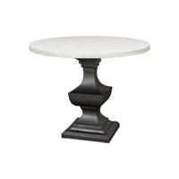 Round marble top dining table, angled view.