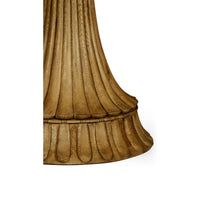 Detailed view of oak center table's ornate base design.