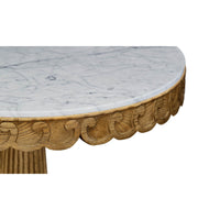 Close-up of marble top and oak table edge design.