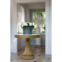 Marble top oak center table in elegant hallway setting.