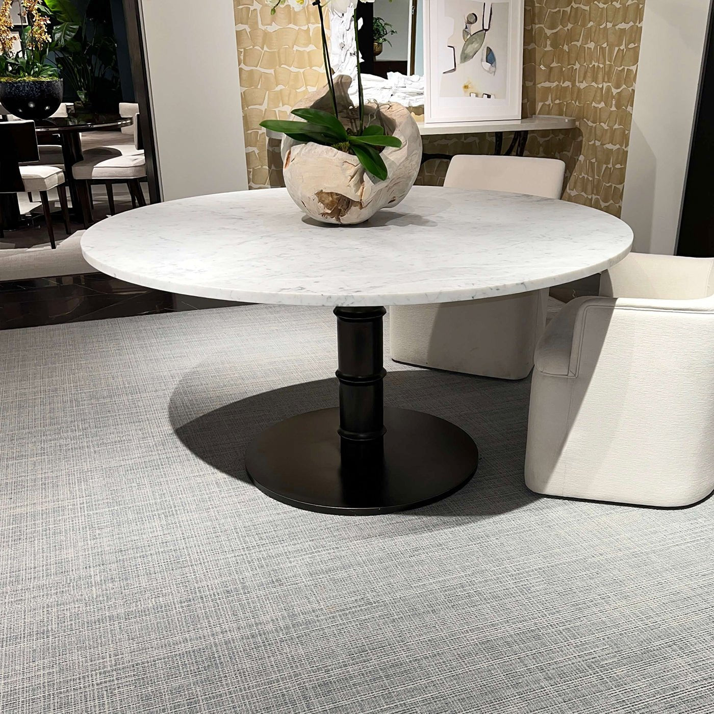 Marble dining table with decorative vase in stylish setting