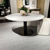 Marble dining table with decorative vase in stylish setting