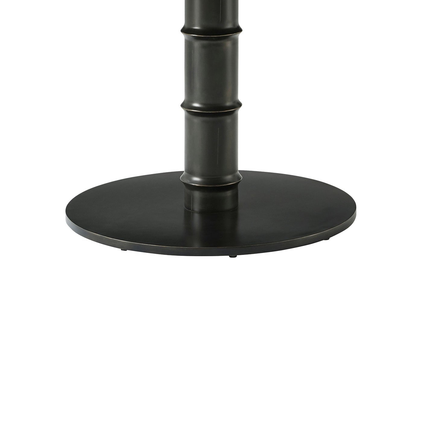 Dark metal base of round marble dining table