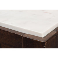 Close-up of marble top corner on console table.