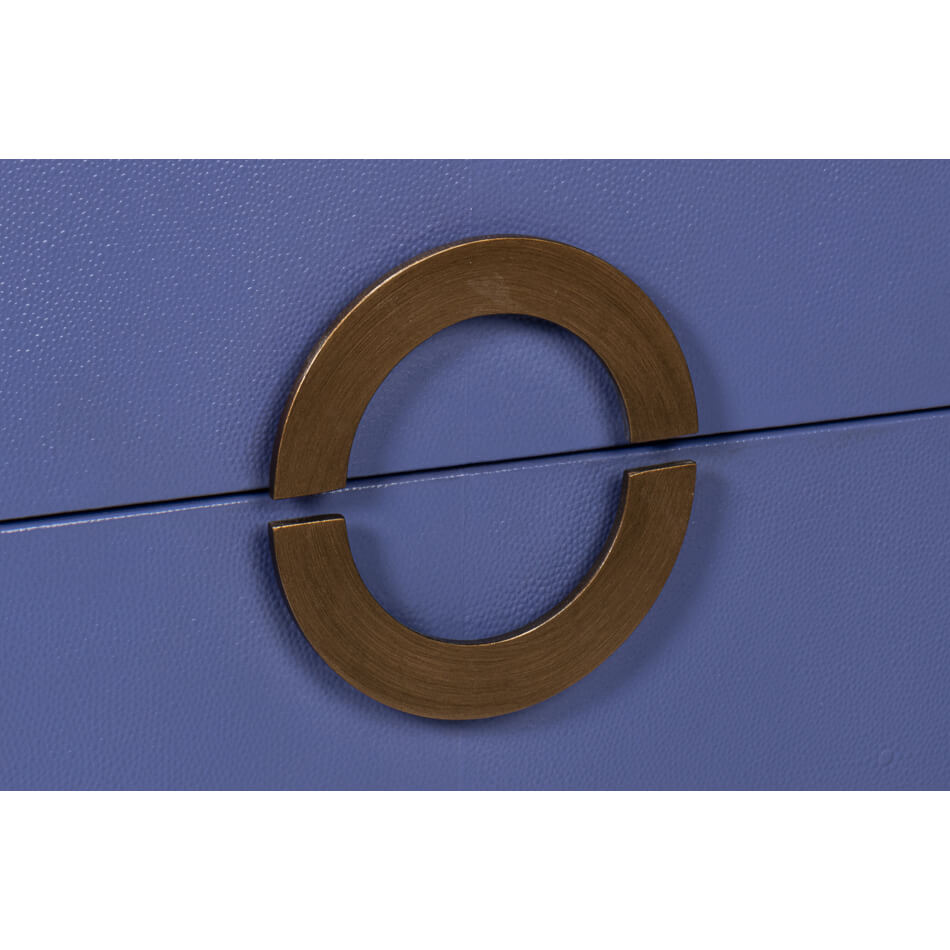 Circular handle detail on blue modern nightstand.