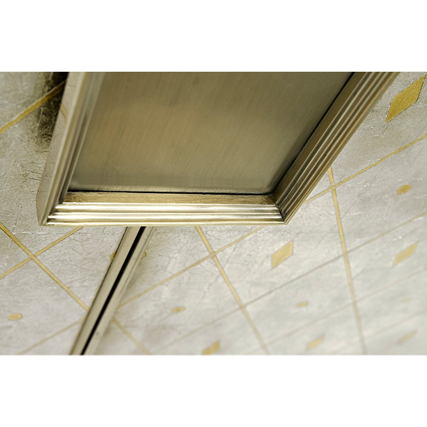 Underside view of cabinet handle and door pattern.