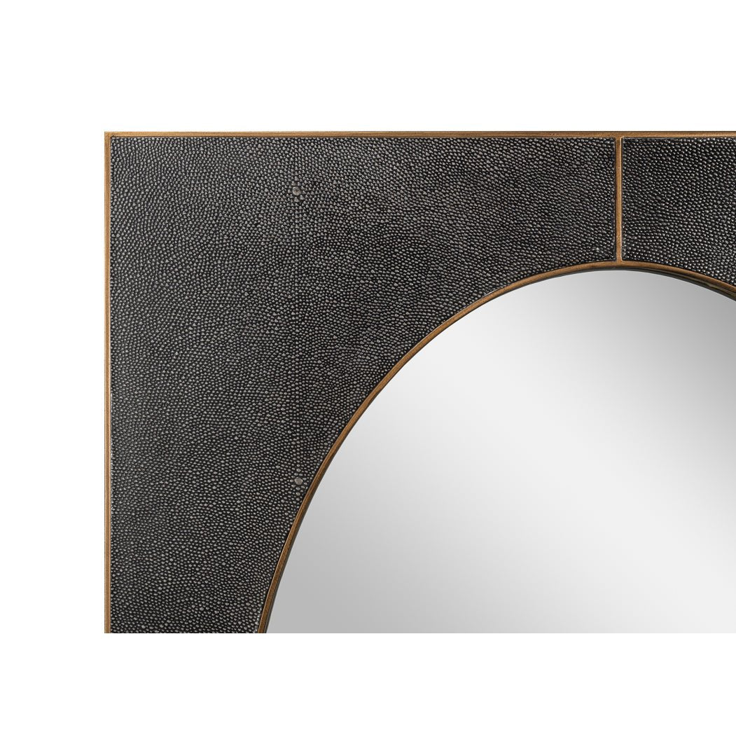 Close-up of corner showing leather texture on mirror.