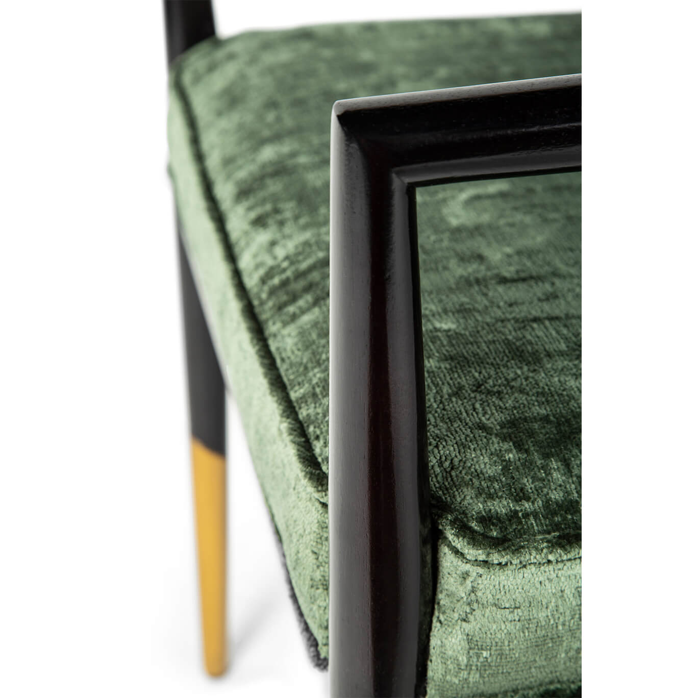 Detailed view of seat cushion and frame on dining armchair.
