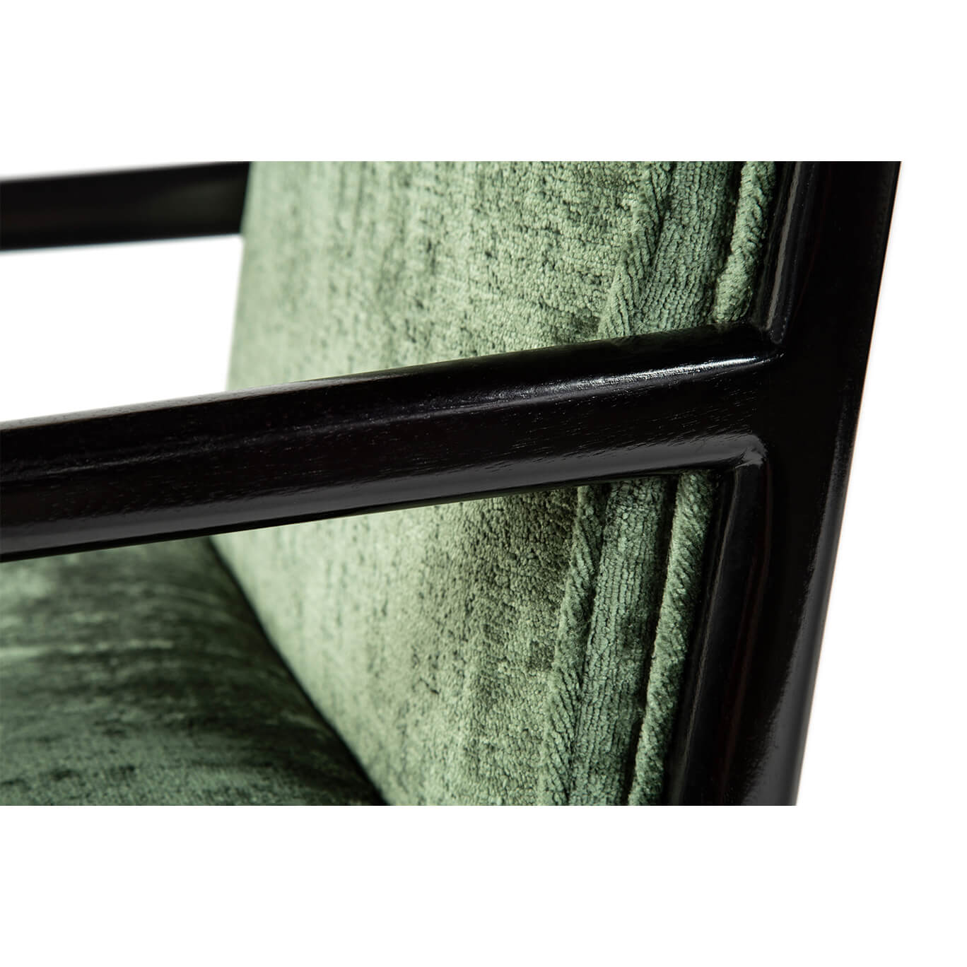 Close-up of upholstery and armrest on dining armchair.