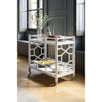 Styled mid-century bar cart in elegant room setting.