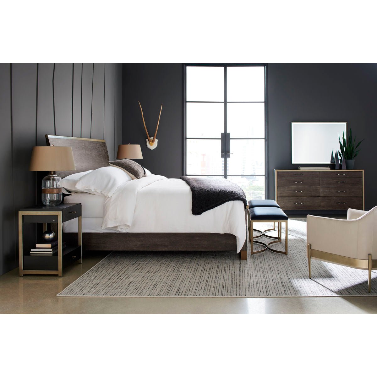 Bedroom scene with mid-century barrel back armchair.
