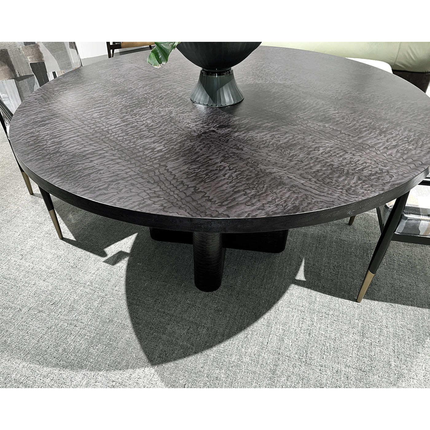 Close-up of black dining table surface with decor.