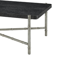 Close-up silver leg and black top coffee table detail