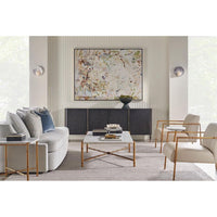 Black sideboard in modern living room setup, artwork above.