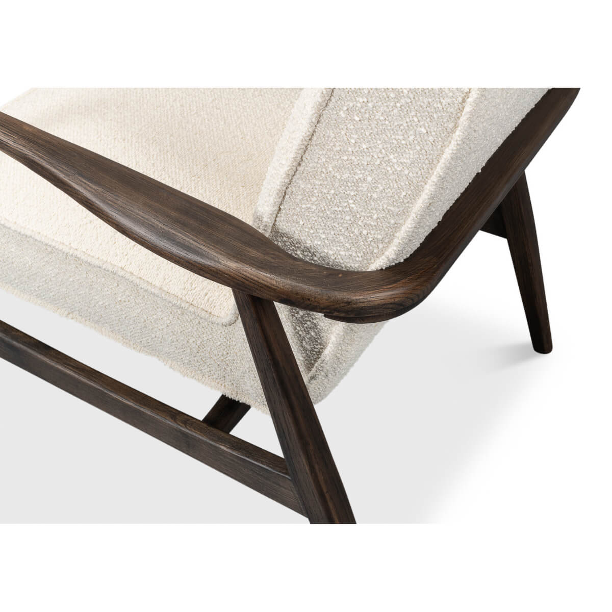 Mid-century boucle armchair close-up armrest detail.