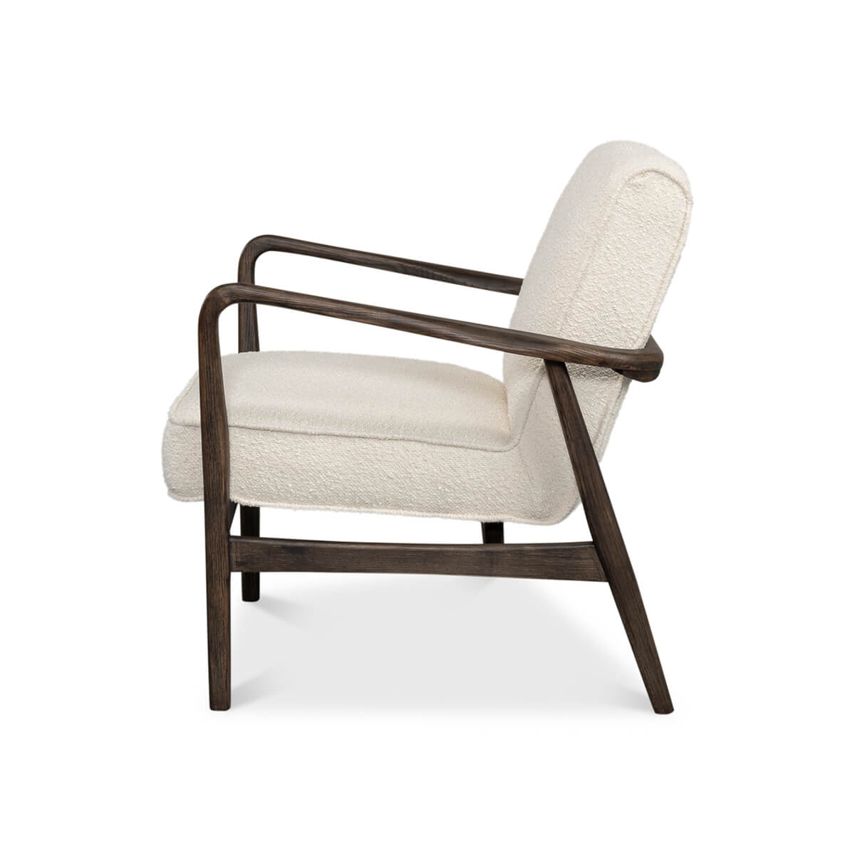Mid-century boucle armchair side profile view.