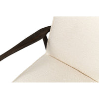 Mid-century boucle armchair close-up seat and backrest.