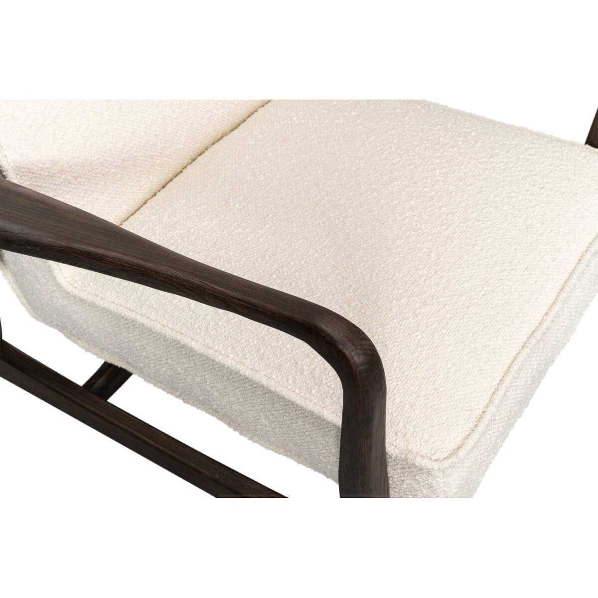 Mid-century boucle armchair armrest and cushion top detail.
