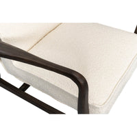 Mid-century boucle armchair armrest and cushion top detail.