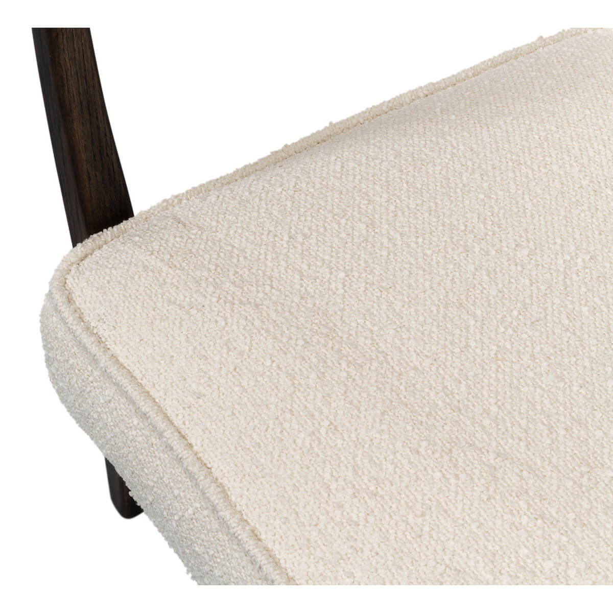 Mid-century boucle armchair close-up seat texture.