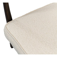 Mid-century boucle armchair close-up seat texture.