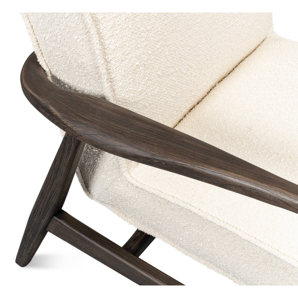 Mid-century boucle armchair angled armrest and cushion.