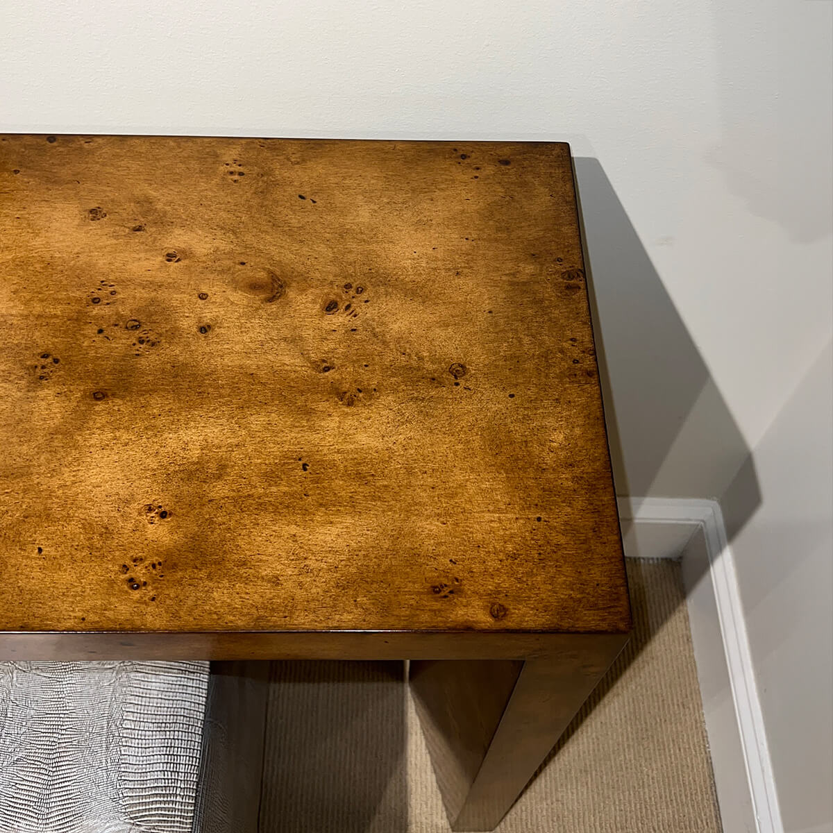 Close-up of console table top corner detail.
