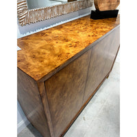 Top surface view of mid-century burl credenza with decor.